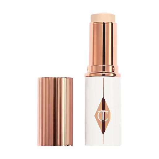 Тональна основа-стік для обличчя Charlotte Tilbury Unreal Skin Sheer Glow Tint, 8 г