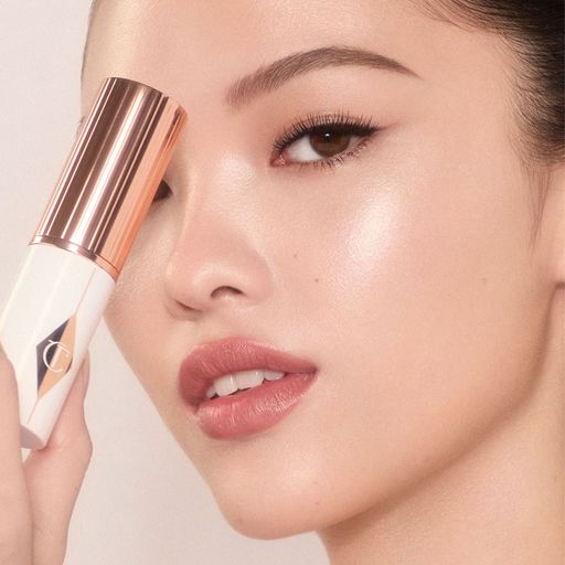 Тональна основа-стік для обличчя Charlotte Tilbury Unreal Skin Sheer Glow Tint, 8 г